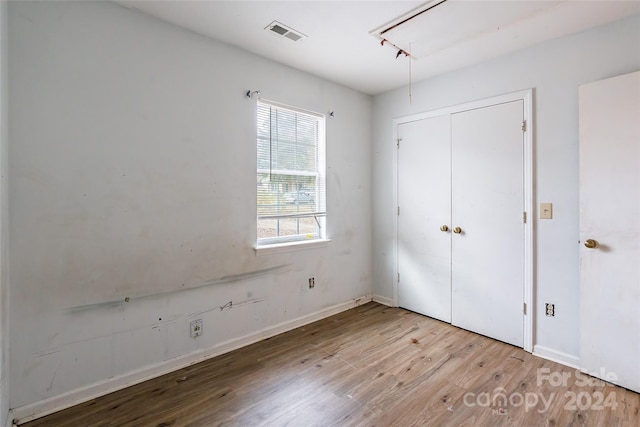 unfurnished bedroom with light hardwood / wood-style flooring