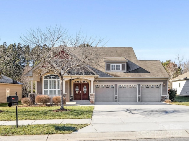 view of front facade featuring a garage and a front yard