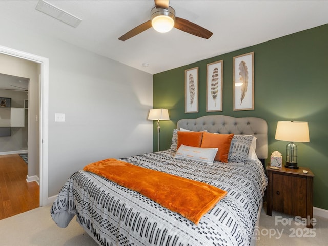 carpeted bedroom with ceiling fan