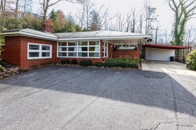 view of front facade featuring a carport