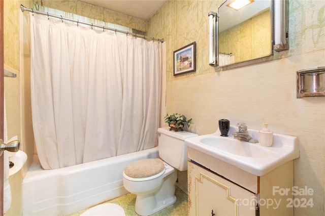 full bathroom with shower / bath combo, vanity, and toilet