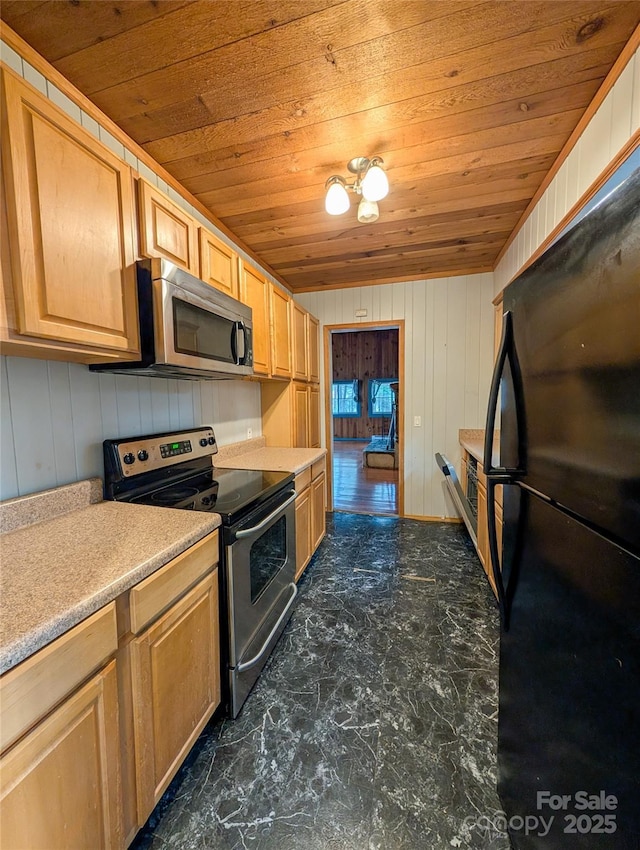 kitchen featuring wood ceiling, appliances with stainless steel finishes, light brown cabinetry, and light countertops