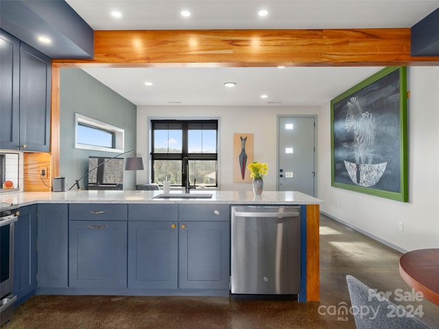 kitchen with blue cabinetry, sink, tasteful backsplash, light stone counters, and appliances with stainless steel finishes