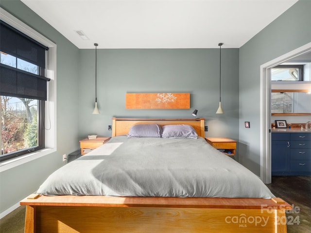 bedroom with dark hardwood / wood-style flooring