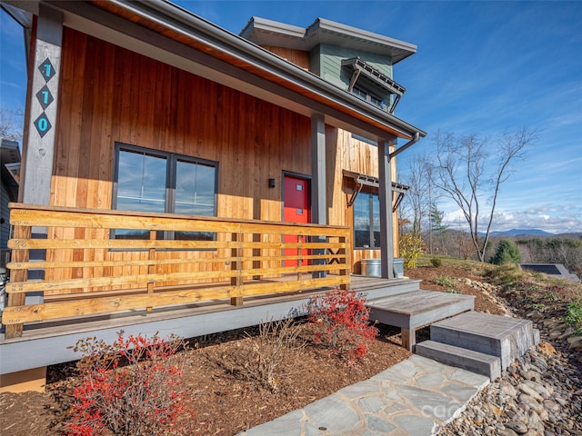 doorway to property with a wooden deck