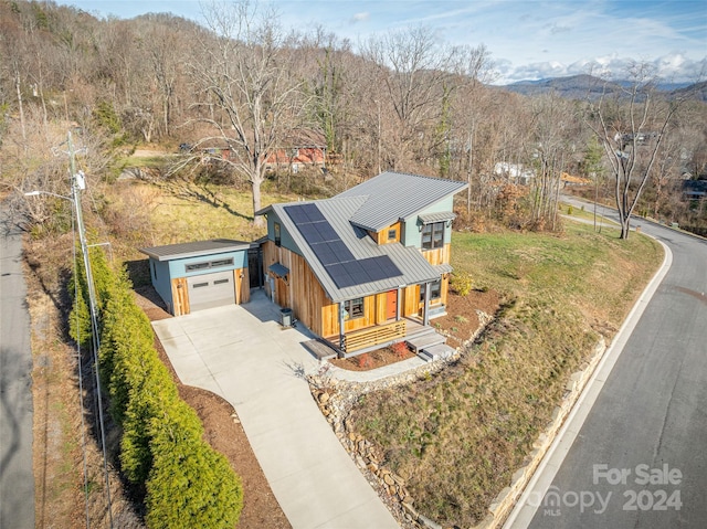 birds eye view of property featuring a mountain view