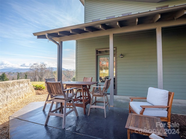 view of patio / terrace with a mountain view