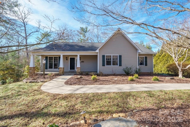 ranch-style home with a porch and a front yard