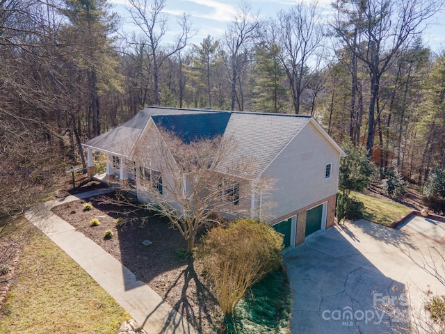 view of side of home featuring a garage