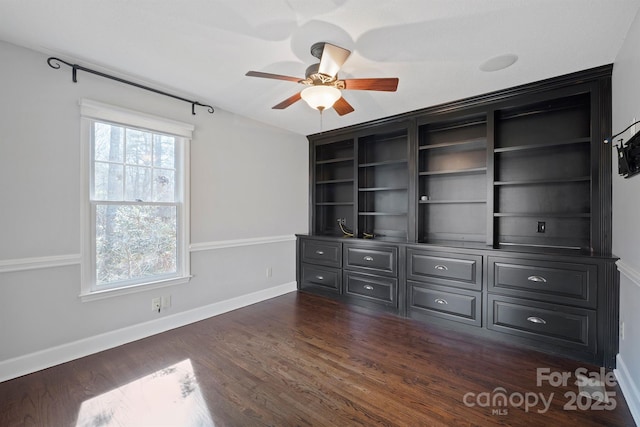 interior space with dark hardwood / wood-style floors and ceiling fan