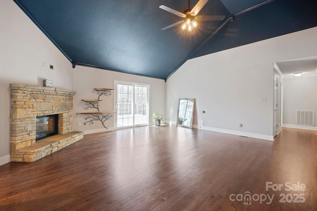 unfurnished living room with hardwood / wood-style floors, high vaulted ceiling, a fireplace, ceiling fan, and crown molding