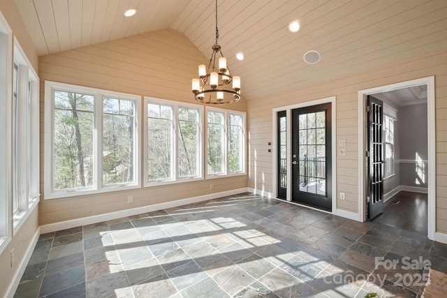 unfurnished sunroom with an inviting chandelier, wood ceiling, and lofted ceiling