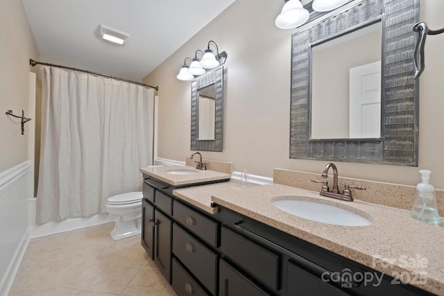 full bathroom featuring shower / tub combo with curtain, vanity, toilet, and tile patterned flooring