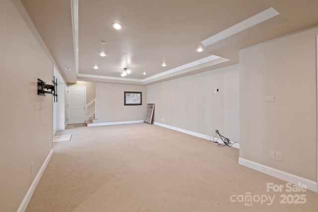 basement with light carpet and ornamental molding