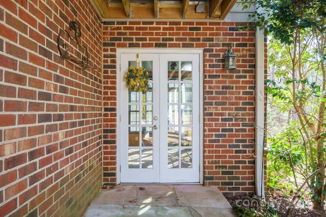 view of exterior entry featuring french doors