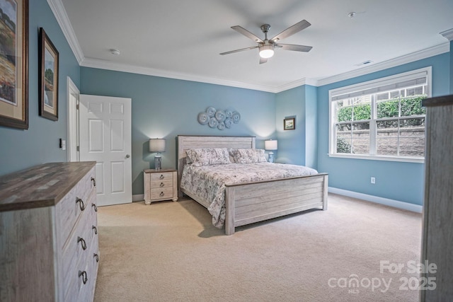 carpeted bedroom with ceiling fan and ornamental molding