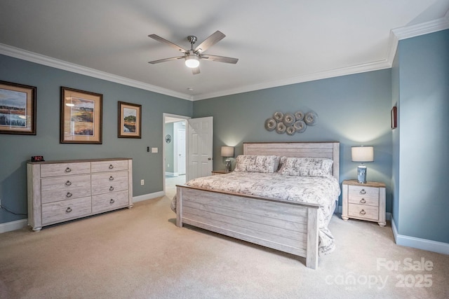 carpeted bedroom with ceiling fan and ornamental molding