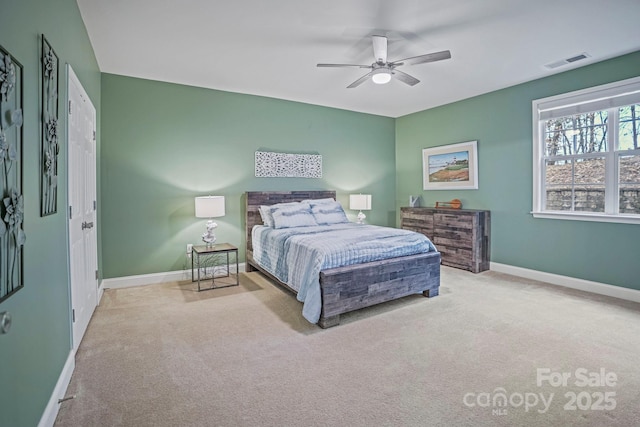 carpeted bedroom featuring ceiling fan