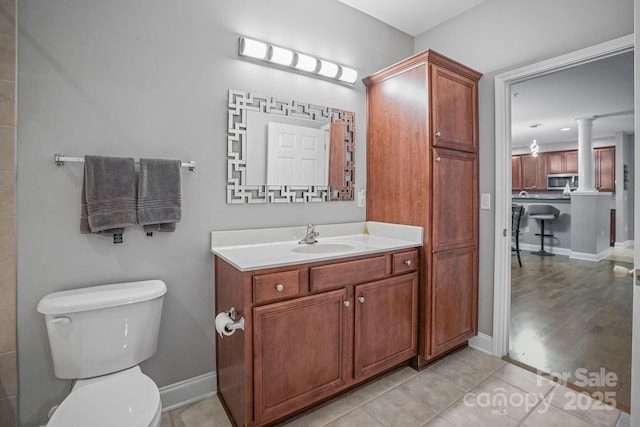 bathroom with vanity and toilet