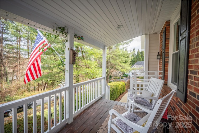 wooden terrace featuring a porch