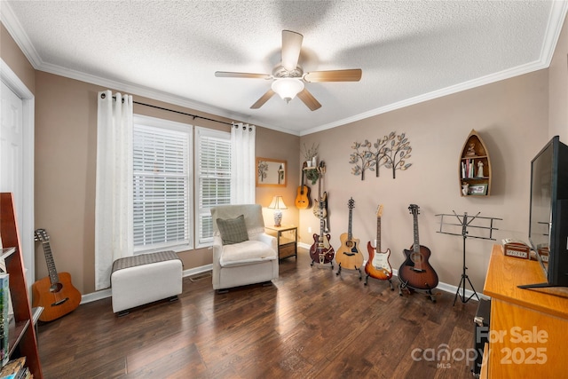 sitting room featuring a textured ceiling, dark hardwood / wood-style flooring, ceiling fan, and crown molding