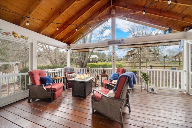 sunroom / solarium with lofted ceiling with beams and wood ceiling