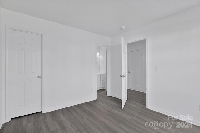 unfurnished bedroom featuring dark hardwood / wood-style floors