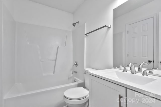 full bathroom featuring toilet, vanity, and tub / shower combination