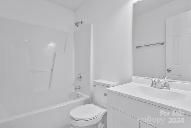 full bathroom with washtub / shower combination, vanity, and toilet