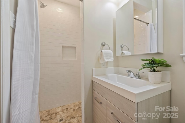 bathroom with vanity and walk in shower