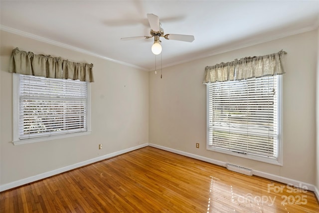 unfurnished room featuring ceiling fan, light wood-type flooring, and crown molding