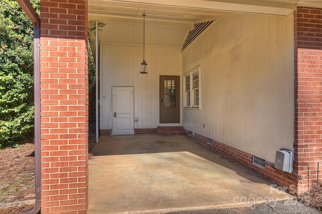 property entrance with a patio