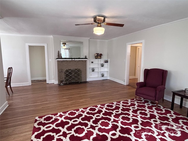 living room featuring crown molding, dark hardwood / wood-style flooring, and a brick fireplace