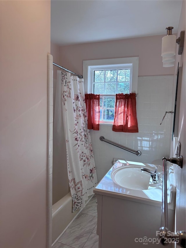 bathroom with vanity and shower / bath combo with shower curtain