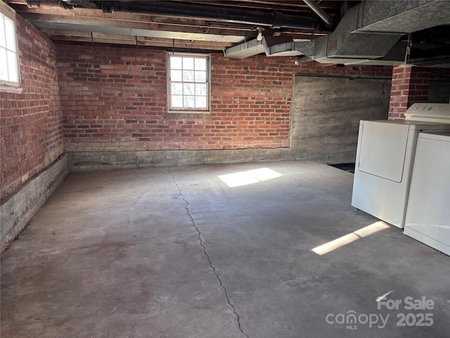 basement with washer and clothes dryer