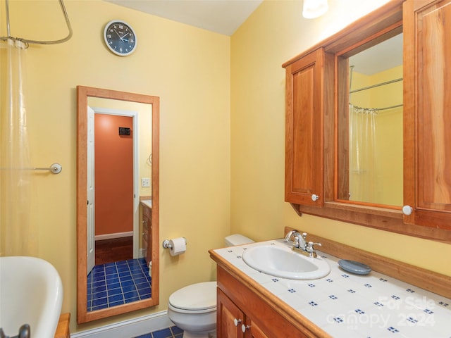 bathroom featuring tile patterned flooring, a shower with curtain, vanity, and toilet