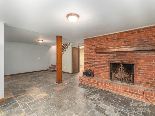 basement with a brick fireplace