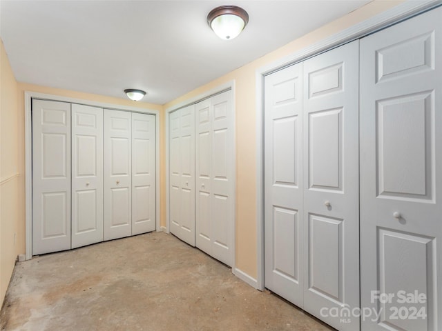 unfurnished bedroom featuring multiple closets