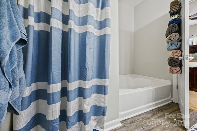 bathroom featuring wood-type flooring