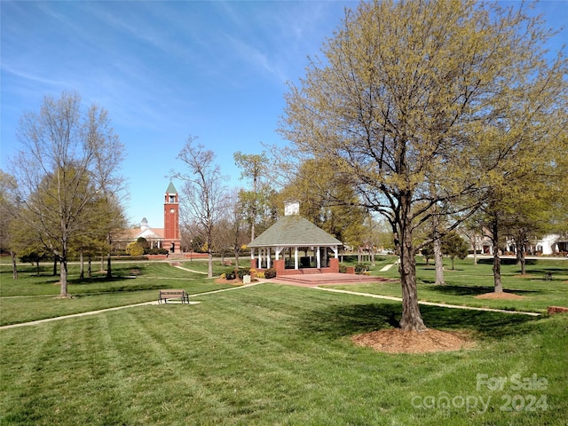 surrounding community featuring a gazebo and a lawn