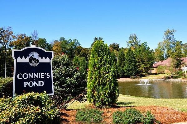 community sign with a water view