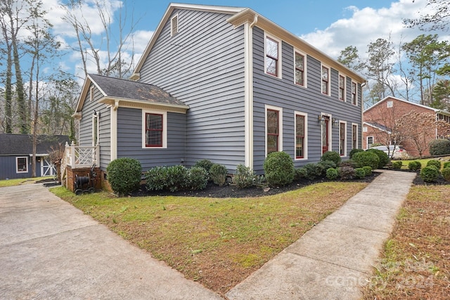 view of home's exterior featuring a lawn