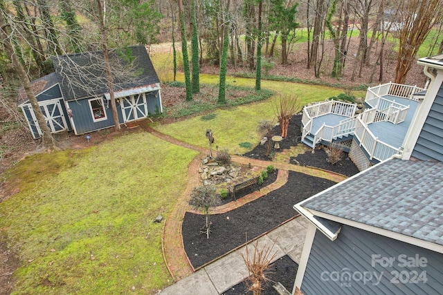 view of yard with an outbuilding and a deck