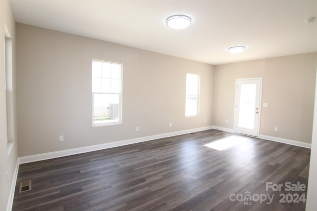 empty room featuring dark hardwood / wood-style floors