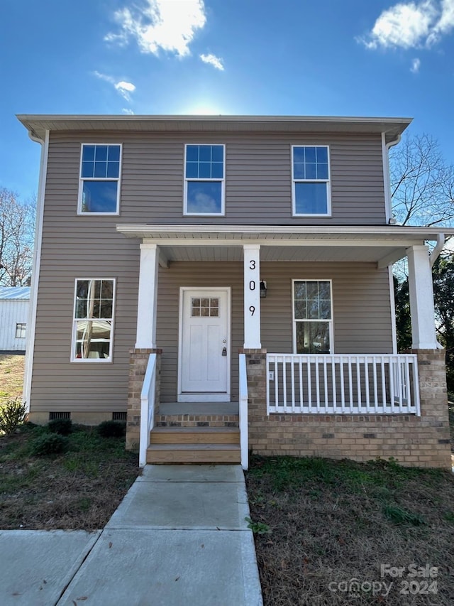 view of front property featuring a porch