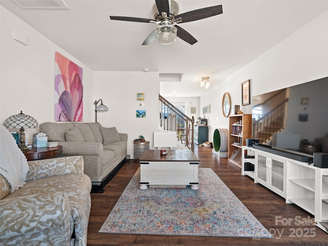 living room with dark hardwood / wood-style floors and ceiling fan