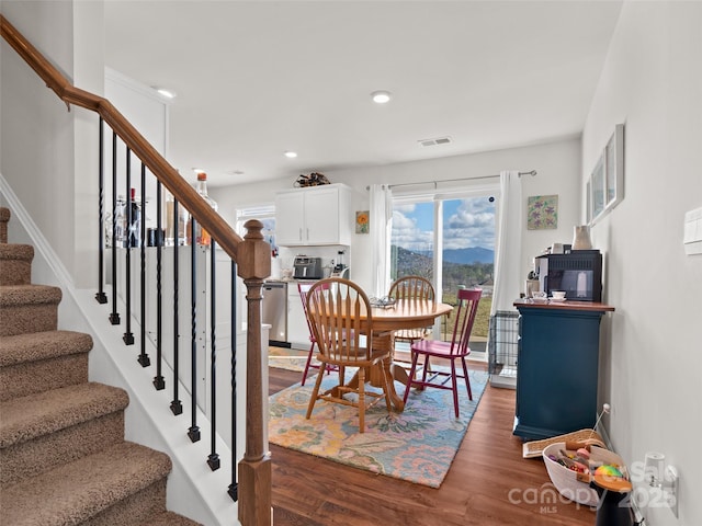 dining area featuring dark hardwood / wood-style floors