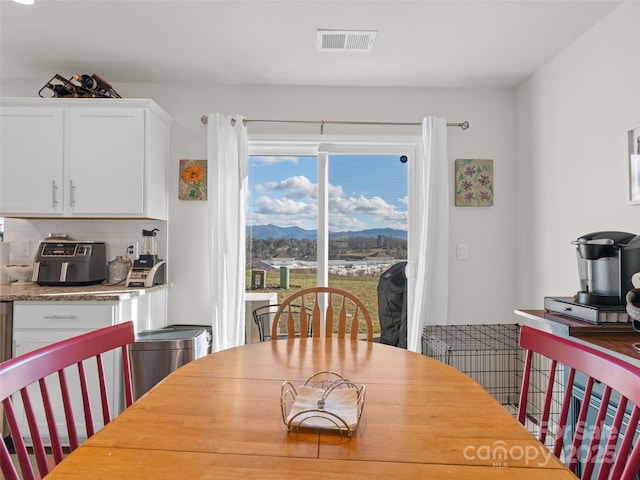 dining room with a mountain view