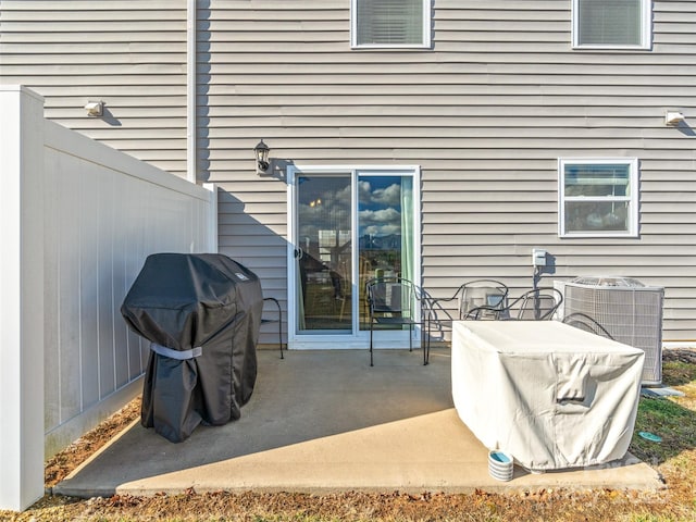 view of patio with area for grilling and central air condition unit