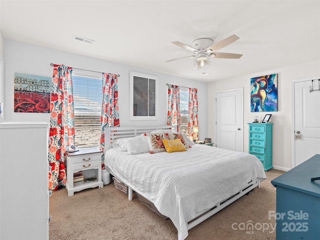 carpeted bedroom with ceiling fan